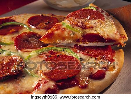Stock Photograph - Salami PizzaPizza, Salami, pepperoni, italian, round, cheese, chopping board. Fotosearch