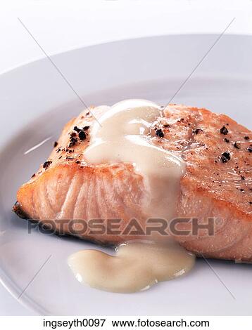 Stock Photo - salmon, salmon steak, hollondaise sauce, black pepper, baked salmon, pink salmon, food. Fotosearch