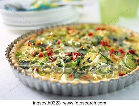 Stock Image - spring onion tart, sring onion, tart, savoury tart, snack, lunch, food. Fotosearch