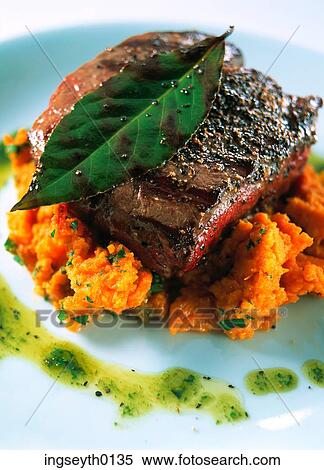 Stock Photography - steak, mashed carrot, mashed carrots, fillet steak, fillet, dinner, main course. Fotosearch