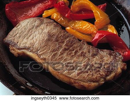 Stock Photography - steak, sirloin, grilled, peppers, red, orange, plate. Fotosearch