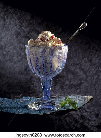 Stock Photo - sundae, ice cream, profiteroles, glass, spoon, desert, food. Fotosearch