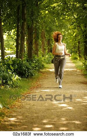 A beautiful woman running View Large Photo Image Stock Image - A beautiful woman running. Fotosearch
