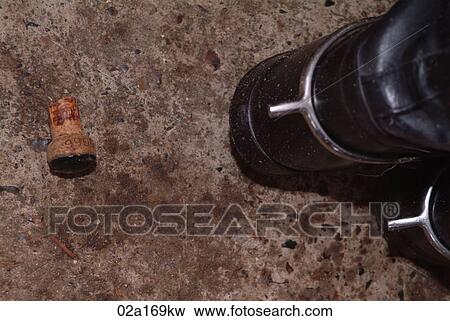 Stock Photo - A champagne cork and a boot. Fotosearch