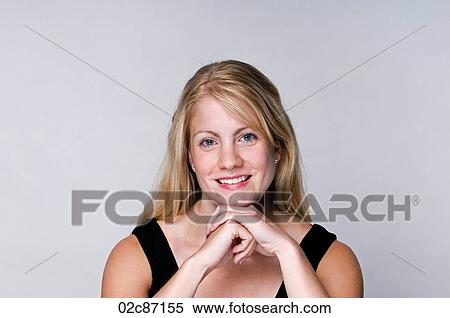 A content young blonde woman. View Large Photo Image Stock Photography - A content young blonde woman.. Fotosearch