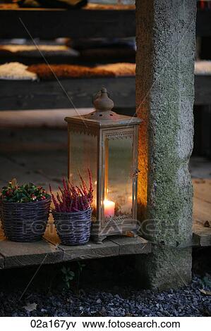 A lantern and flowers View Large Photo Image Stock Photo - A lantern and flowers. Fotosearch