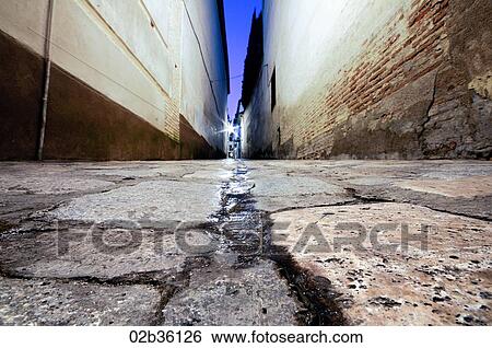 A low perspective view of an alleyway in Andalusia, Spain View Large Photo Image Stock Photograph - A low perspective view of an alleyway in Andalusia, Spain. Fotosearch
