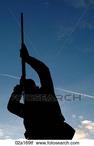 A man aiming his gun View Large Photo Image Stock Image - A man aiming his gun. Fotosearch
