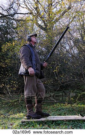 A man with a hunting rifle View Large Photo Image Stock Photograph - A man with a hunting rifle. Fotosearch