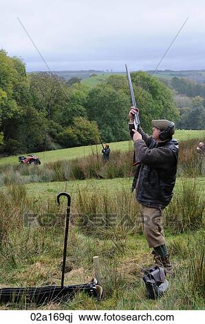 A men shooting guns View Large Photo Image Stock Image - A men shooting guns. Fotosearch