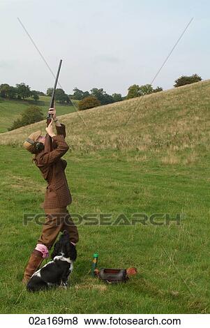 A woman shooting upwards View Large Photo Image Stock Photo - A woman shooting upwards. Fotosearch