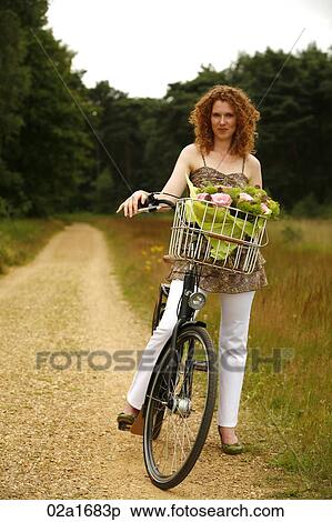 A woman with a bike View Large Photo Image Stock Photography - A woman with a bike. Fotosearch