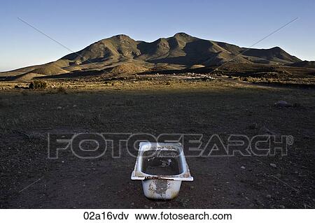 Stock Photo - Abandoned bath tub in rural setting. Fotosearch