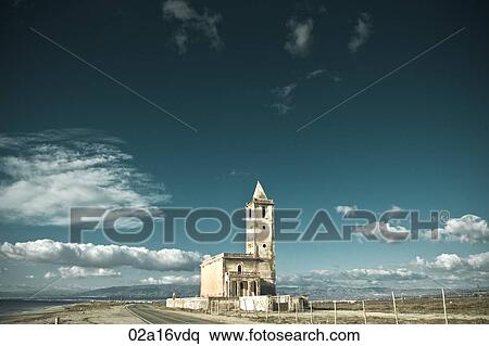 Abandoned building on coastal road under blue sky View Large Photo Image Stock Photography - Abandoned building on coastal road under blue sky. Fotosearch