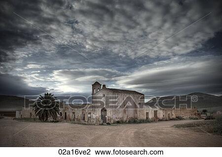Stock Image - Abandoned buildings and overcast sky. Fotosearch
