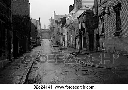 Stock Image - Abandoned rainy street in Quebec City Canada.. Fotosearch