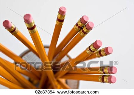 Aerial view of new orange HB pencils in holder, on white background. View Large Photo Image Picture - Aerial view of new orange HB pencils in holder, on white background.. Fotosearch