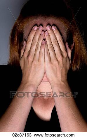 Afraid woman covering face with hands. View Large Photo Image Stock Image - Afraid woman covering face with hands.. Fotosearch