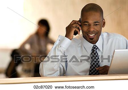 African-american businessman talking on PDA smart phone. View Large Photo Image Stock Image - African-american businessman talking on PDA smart phone.. Fotosearch