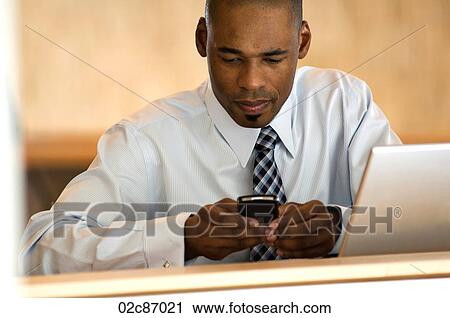 African-american businessman working on PDA. View Large Photo Image Stock Image - African-american businessman working on PDA.. Fotosearch