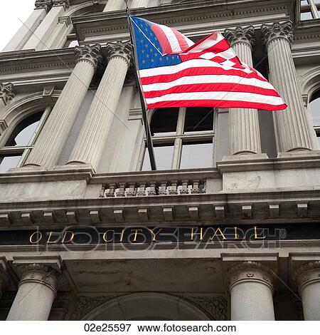 Stock Photo - American flag on the Old City Hall building in Boston, Massachusetts, USA. Fotosearch