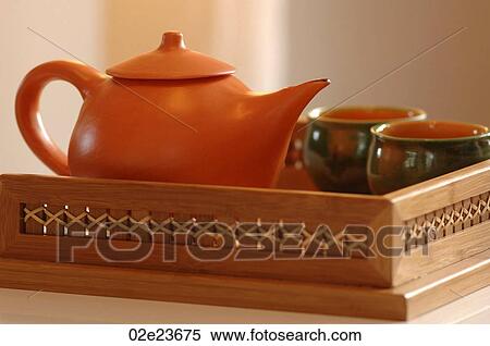 An Asian orange tranquil tea pot for two. View Large Photo Image Stock Photography - An Asian orange tranquil tea pot for two.. Fotosearch
