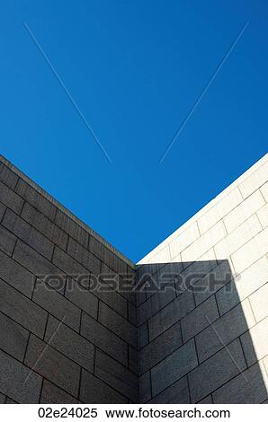 Stock Photography - Architectural brick wall with blue sky.. Fotosearch