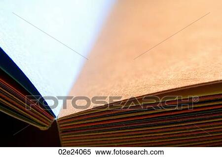 Stock Photography - Assorted blank pages of colored paper in book.. Fotosearch