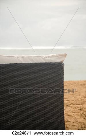 Stock Image - Back of chaise chair on beach in Bali. Fotosearch