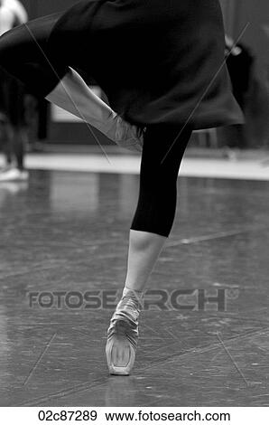 Stock Photo - Ballet dancer practicing dances moves in studio.. Fotosearch