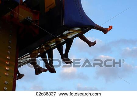 Bare-feet dangling from kid's amusement park ride. View Large Photo Image Stock Photo - Bare-feet dangling from kid's amusement park ride.. Fotosearch