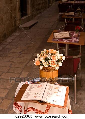 Basket of flowers on a table in Dubrovnik View Large Photo Image Stock Photography - Basket of flowers on a table in Dubrovnik. Fotosearch