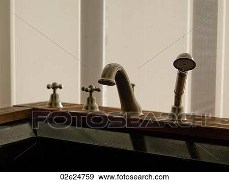 Bath taps and shower nozzel View Large Photo Image Stock Photo - Bath taps and shower nozzel. Fotosearch