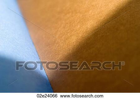 Stock Photograph - Blue and brown paper pages in a blank book.. Fotosearch