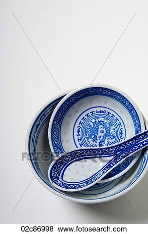 Stock Photo - Blue asian soup bowls and spoon.. Fotosearch