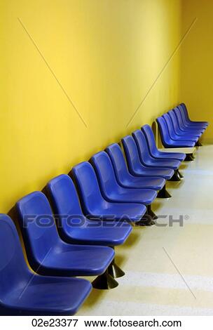 Blue waiting room chairs with yellow wall. View Large Photo Image Stock Photo - Blue waiting room chairs with yellow wall.. Fotosearch