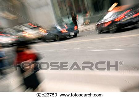 Stock Image - Blurred downtown street scene.. Fotosearch