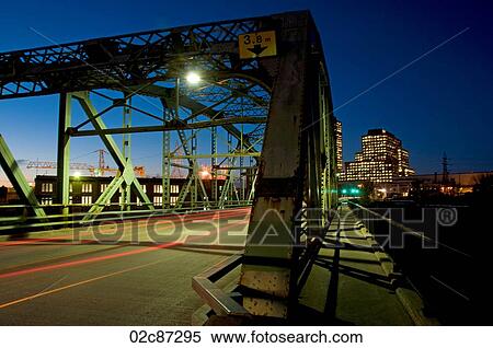 Stock Photography - Blurring lights on Chaudiére Bridge, Ottawa, Canada at dusk.. Fotosearch