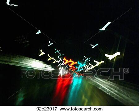 Stock Photo - Blurring street lights of night traffic.. Fotosearch