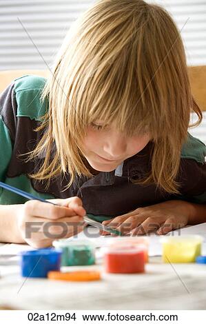 Boy painting with watercolour paints View Large Photo Image Picture - Boy painting with watercolour paints. Fotosearch