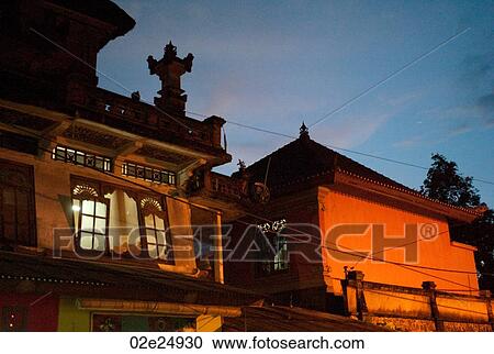 Buildings against evening sky in Bali View Large Photo Image Stock Image - Buildings against evening sky in Bali. Fotosearch