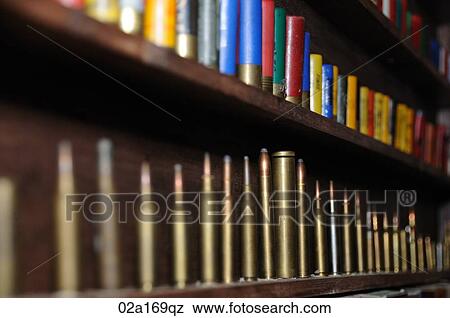 Bullet cartridges on a shelf View Large Photo Image Stock Photo - Bullet cartridges on a shelf. Fotosearch