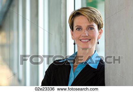 Business woman standing in hallway. View Large Photo Image Stock Photograph - Business woman standing in hallway.. Fotosearch