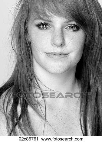 Stock Image - B&W close-up portrait of young woman.. Fotosearch