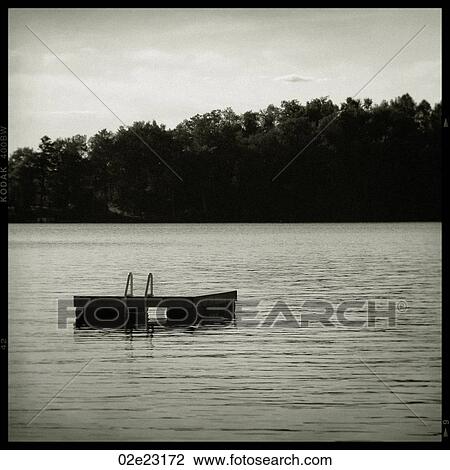B&W swimming raft at the cottage. View Large Photo Image Stock Image - B&W swimming raft at the cottage.. Fotosearch