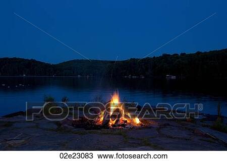 Campfire at lake cottage. View Large Photo Image Stock Image - Campfire at lake cottage.. Fotosearch