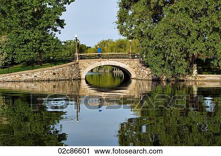 Stock Image - Canadian cities, old stone bridge over Rideau Canal, Ottawa Canada.. Fotosearch