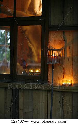 Candles next to a window View Large Photo Image Stock Photo - Candles next to a window. Fotosearch