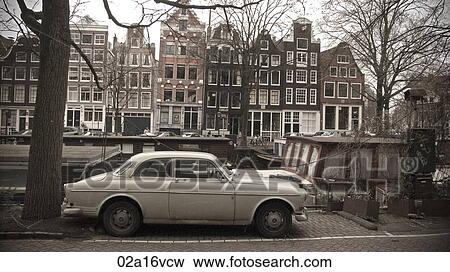 Car parked by canal in winter View Large Photo Image Stock Photo - Car parked by canal in winter. Fotosearch