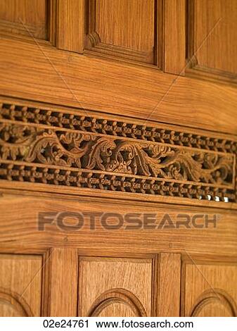 Carved wood panel wall in Bali View Large Photo Image Stock Image - Carved wood panel wall in Bali. Fotosearch